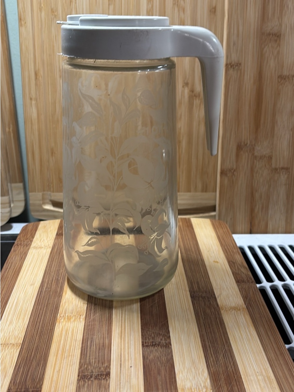 Vintage Tang Clear Glass Juice Pitcher with White Pour Lid Floral Etched Carafe
